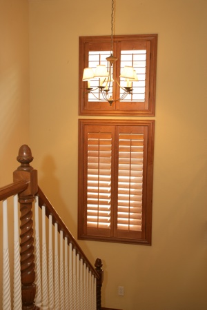 Ovation shutters in tan staircase.